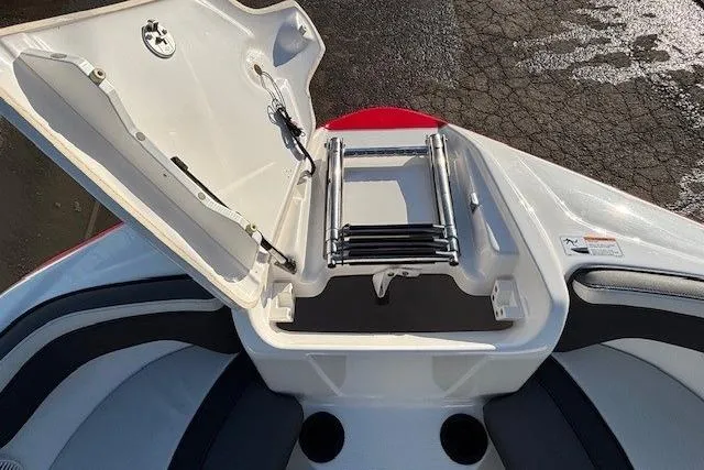 Slide: The Image of 2021 Yamaha AR210 boat with open bow storage and ladder. - 7