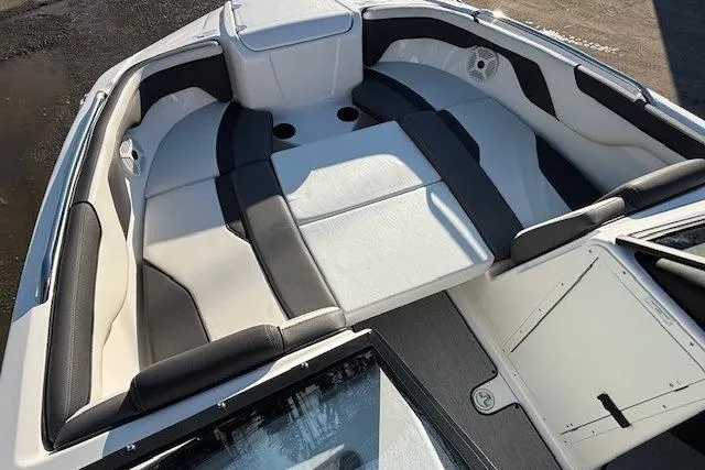Slide: The Image of 2021 Yamaha Boats AR210 interior with spacious seating and modern design. - 9