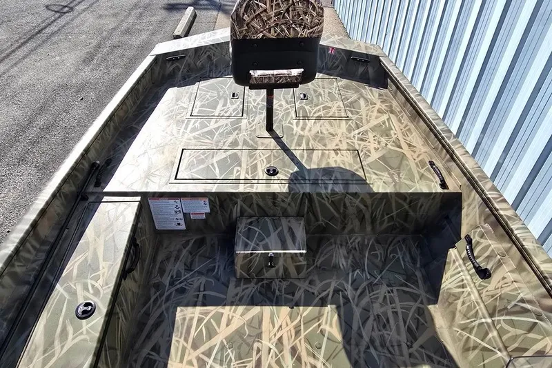 Slide: The Image of 2026 Lowe Roughneck RX2070 SC boat with camouflage design, featuring storage compartments and seating. - 3
