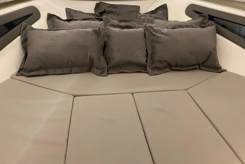 Slide: The Image of Luxurious interior seating with cushions in a 2026 Hanover 375 model boat. - 20