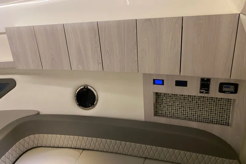 Slide: The Image of Interior of 2026 Hanover 375 boat with modern cabinetry and control panel. - 7