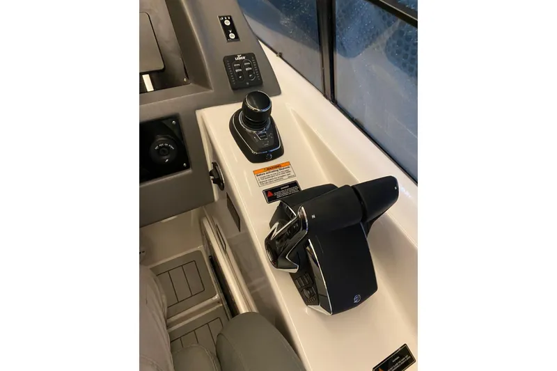 Slide: The Image of Control panel of 2026 Hanover 375 boat with joystick and throttle controls. - 9