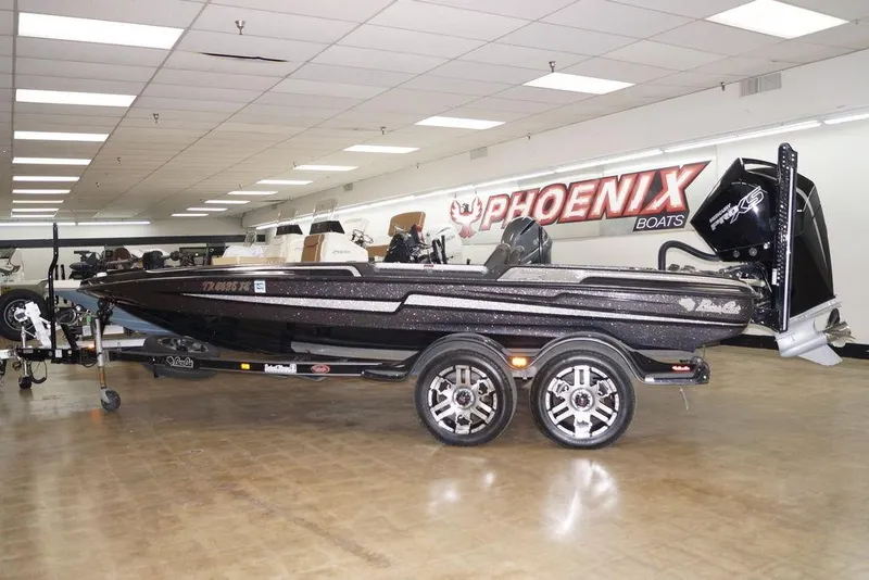 The Image of 2020 Bass Cat Lynx boat in showroom, featuring sleek design and modern features. - 0