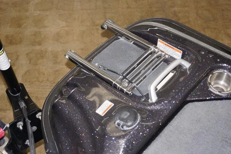 Slide: The Image of 2020 Bass Cat Lynx boat deck with metallic finish and storage compartments. - 24