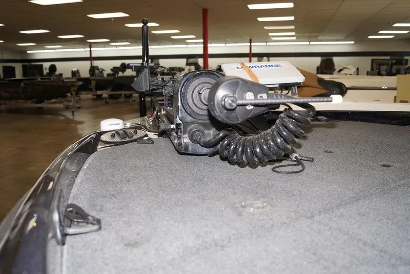 Slide: The Image of 2020 Bass Cat Lynx boat with trolling motor and Lowrance electronics in showroom. - 25