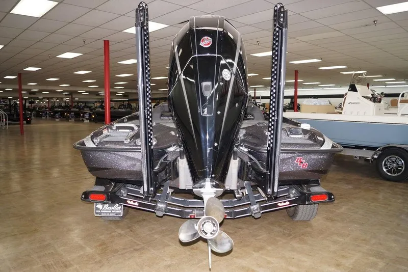 Slide: The Image of 2020 Bass Cat Lynx boat in showroom, rear view with motor and propeller. - 5
