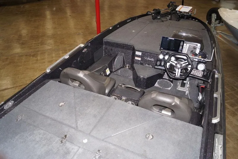 Slide: The Image of 2020 Bass Cat Lynx boat interior with advanced navigation system and dual seating. - 7