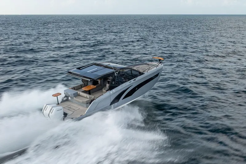 Slide: The Image of 2026 Hanover 387 boat cruising swiftly on open water. - 1