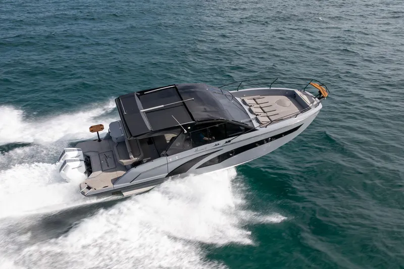 Slide: The Image of 2026 Hanover 387 boat cruising swiftly on open water. - 6