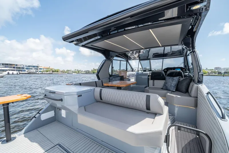 Slide: The Image of Luxurious 2026 Hanover 387 yacht interior with modern seating and sleek design on a sunny day. - 13