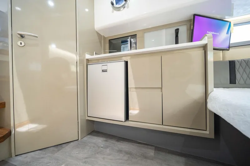 Slide: The Image of Modern interior of 2026 Hanover 387 with sleek cabinetry and compact fridge. - 25