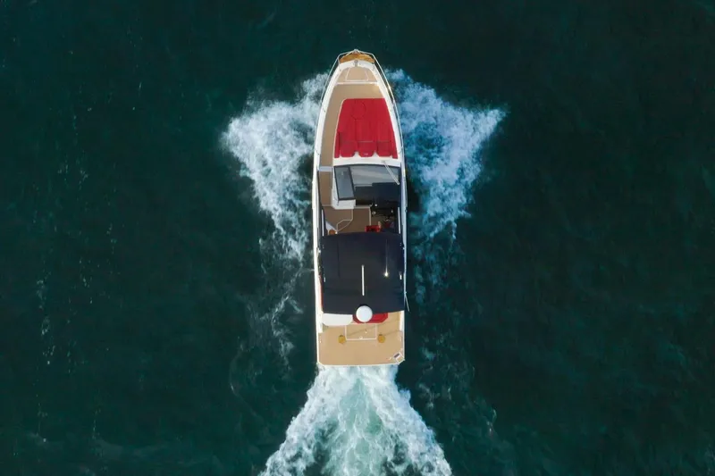 Slide: The Image of Aerial view of 2026 Hanover 387 boat cruising on open water. - 2