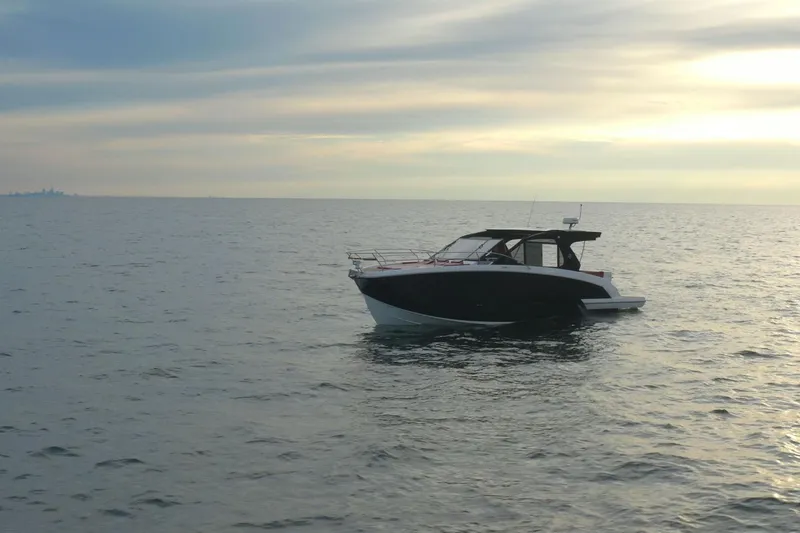 Slide: The Image of 2026 Hanover 387 boat on calm sea at sunset. - 5