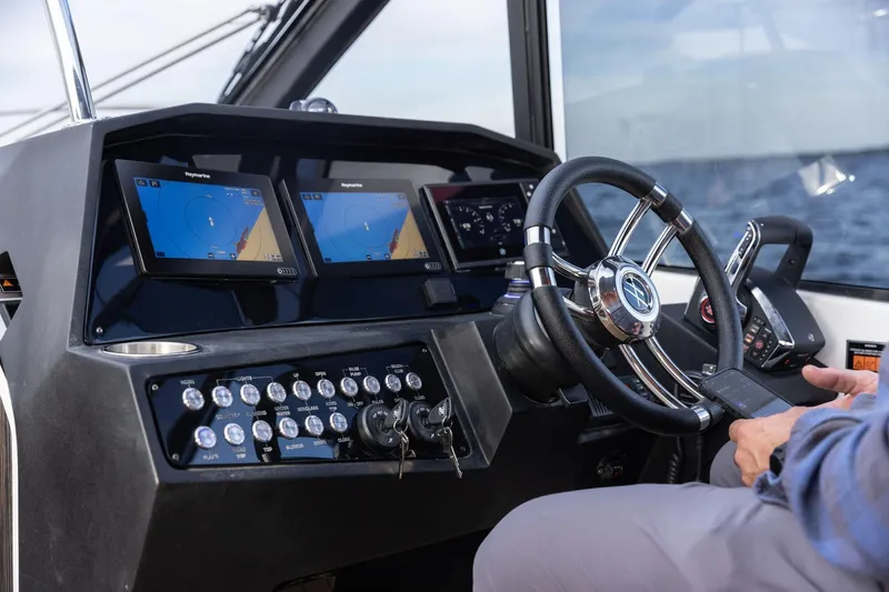 Slide: The Image of Helm of 2026 Hanover 387 boat with advanced navigation displays and controls. - 6