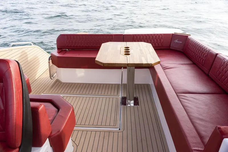 Slide: The Image of Luxurious Hanover 387 boat interior with red seating and wooden table, 2026 model. - 9