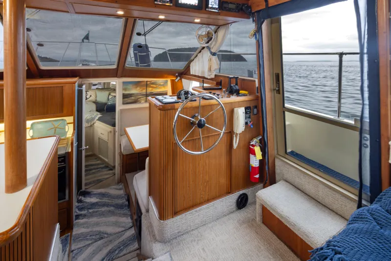 Slide: The Image of Interior of 1990 Tollycraft 44 Cockpit Motor Yacht with helm and cabin view. - 15