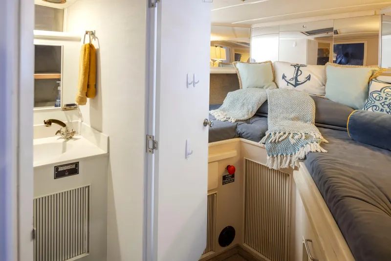 Slide: The Image of Interior of 1990 Tollycraft 44 Cockpit Motor Yacht with cozy bed and compact bathroom. - 28