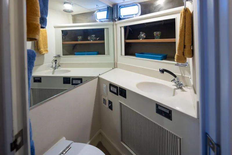 Slide: The Image of Bathroom interior of 1990 Tollycraft 44 Cockpit Motor Yacht with sink and mirror. - 30