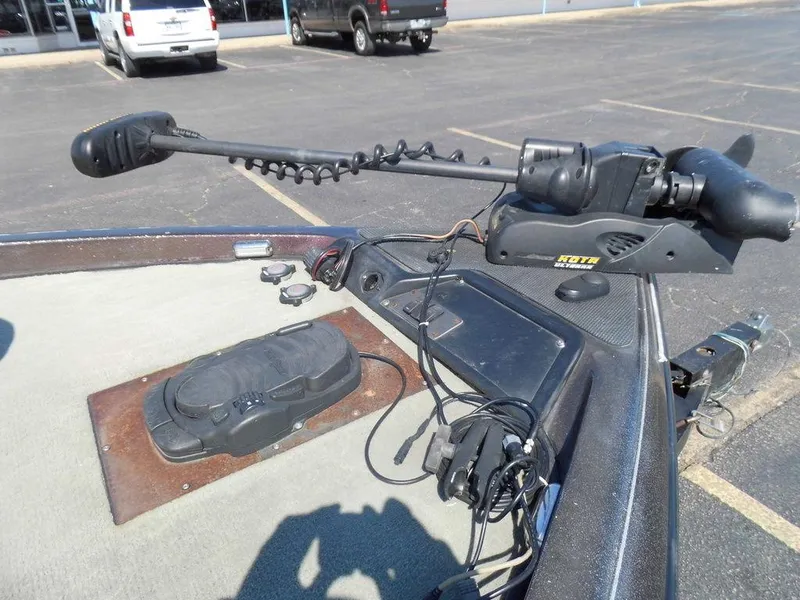 Slide: The Image of Ranger 520DVX Comanche 2000 with trolling motor in parking lot. - 13