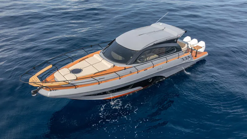 Slide: The Image of Luxurious 2025 Hanover 415 yacht cruising on clear blue ocean waters. - 13