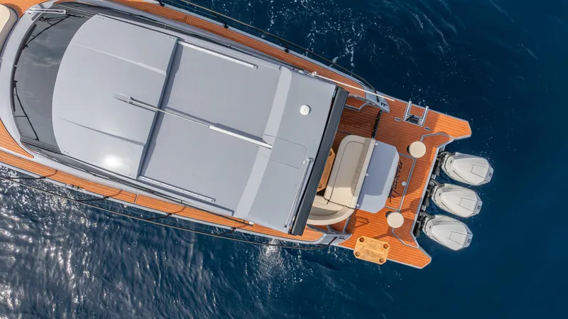 Slide: The Image of Aerial view of 2025 Hanover 415 yacht on blue ocean water. - 15