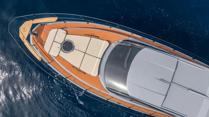 Slide: The Image of Aerial view of 2025 Hanover 415 yacht with sleek deck design on blue ocean. - 16