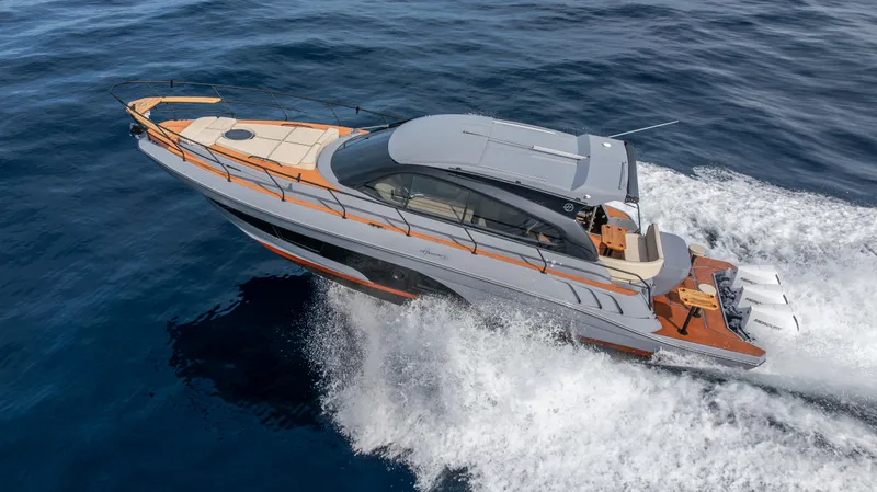 Slide: The Image of Sleek 2025 Hanover 415 yacht cruising on open sea. - 19
