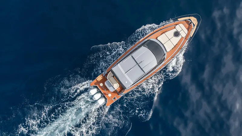 Slide: The Image of Aerial view of 2025 Hanover 415 yacht cruising on open water. - 2