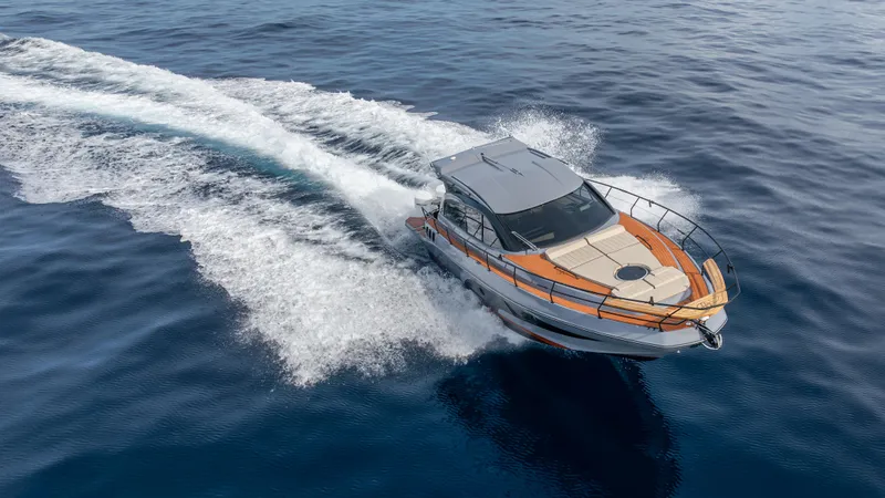 Slide: The Image of 2025 Hanover 415 boat cruising on open water, aerial view. - 29