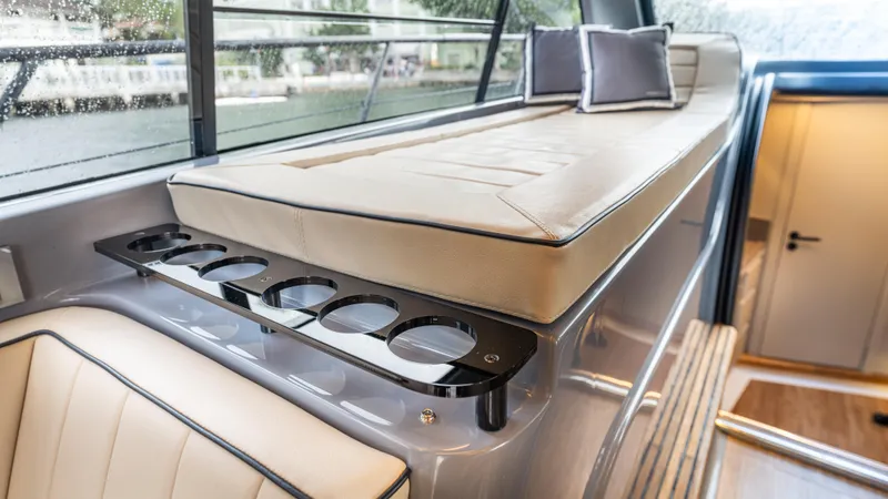 Slide: The Image of Luxurious interior of 2026 Hanover 415 yacht with seating and cup holders. - 24