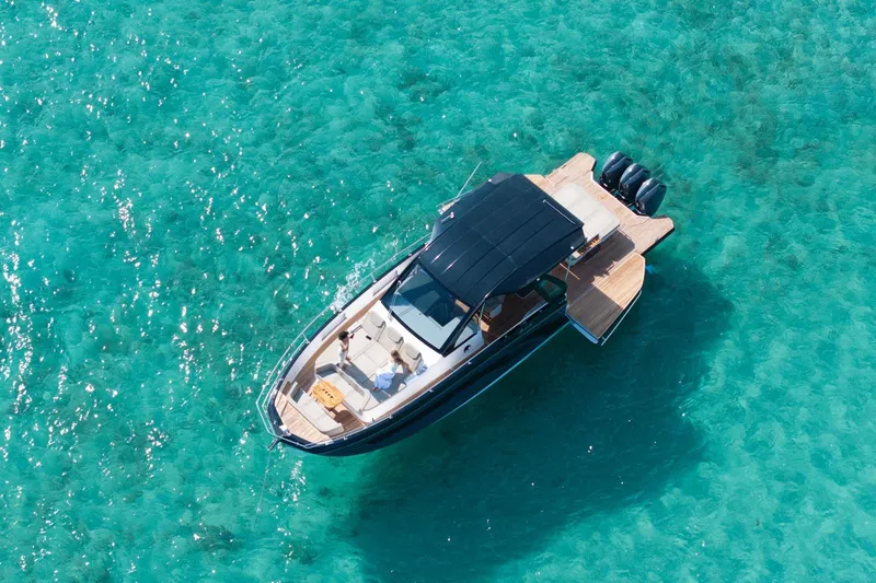 Slide: The Image of Aerial view of 2026 Hanover 447 boat on clear turquoise water. - 14