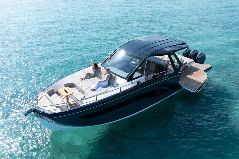 Slide: The Image of 2026 Hanover 447 luxury boat on clear blue water, featuring sleek design and spacious deck. - 16