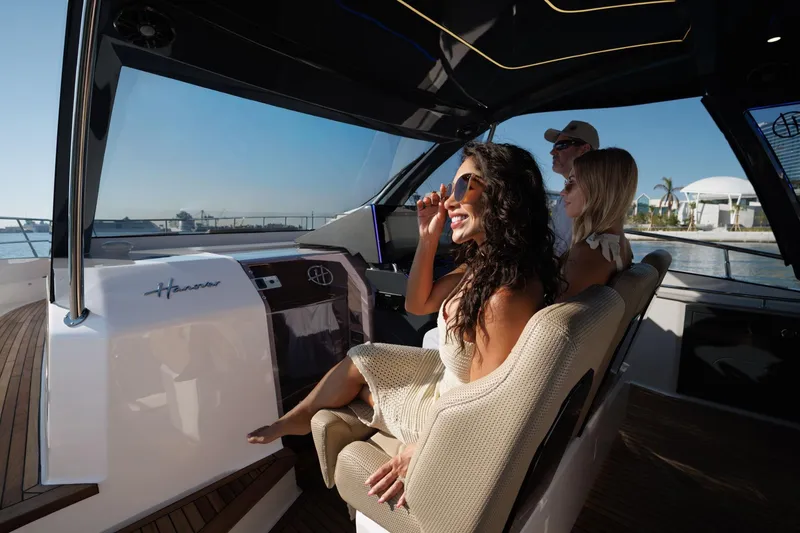 Slide: The Image of Luxurious Hanover 447 yacht interior with passengers enjoying a sunny day, 2026 model. - 28