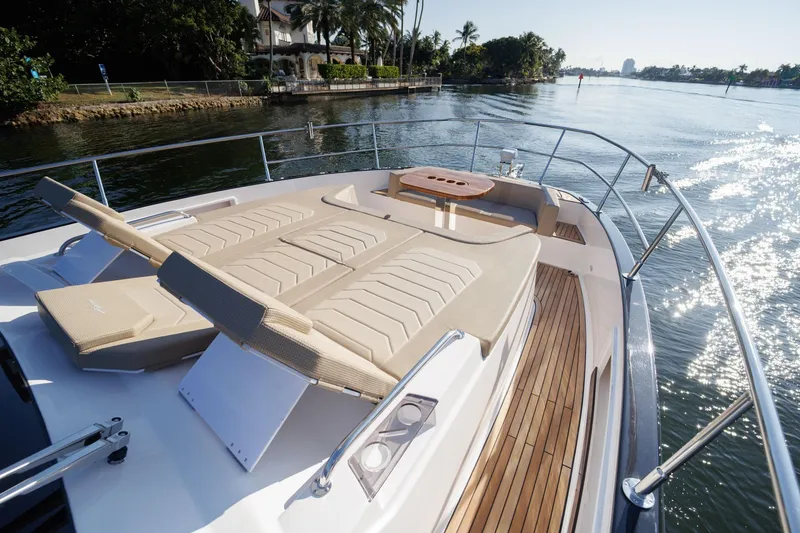 Slide: The Image of Luxurious Hanover 447 yacht deck with sun loungers, cruising on a sunny day, 2026 model. - 44