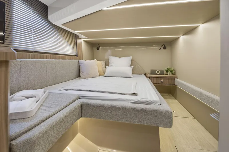 Slide: The Image of Luxurious cabin interior of 2026 Hanover 447 yacht with modern bedding and ambient lighting. - 49