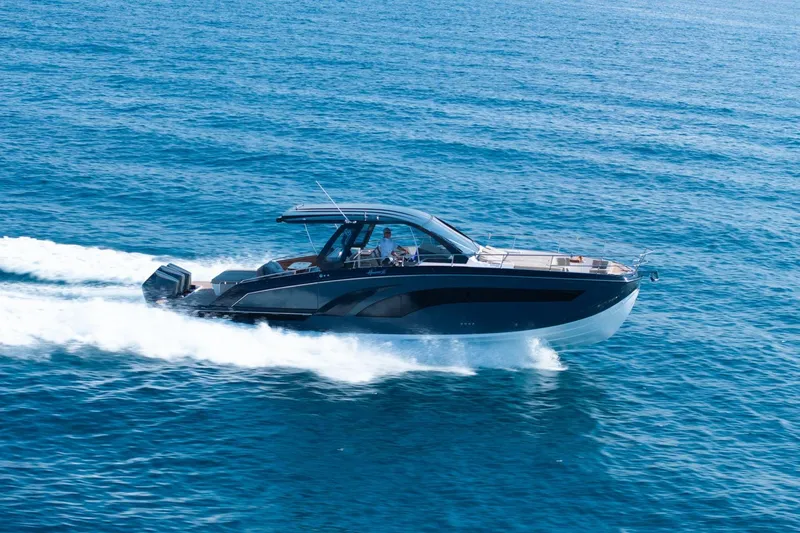 Slide: The Image of 2026 Hanover 447 boat cruising on open blue sea. - 6