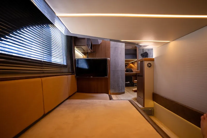 Slide: The Image of Luxurious interior of 2026 Hanover 447 RV with modern amenities and cozy seating. - 13
