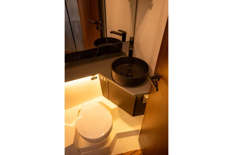 Slide: The Image of Modern bathroom in Hanover 447, 2026 model, featuring sleek fixtures and ambient lighting. - 18