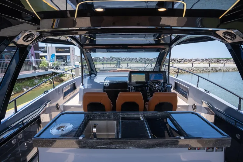 Slide: The Image of Luxurious 2026 Hanover 447 yacht interior with modern helm and sleek design. - 5