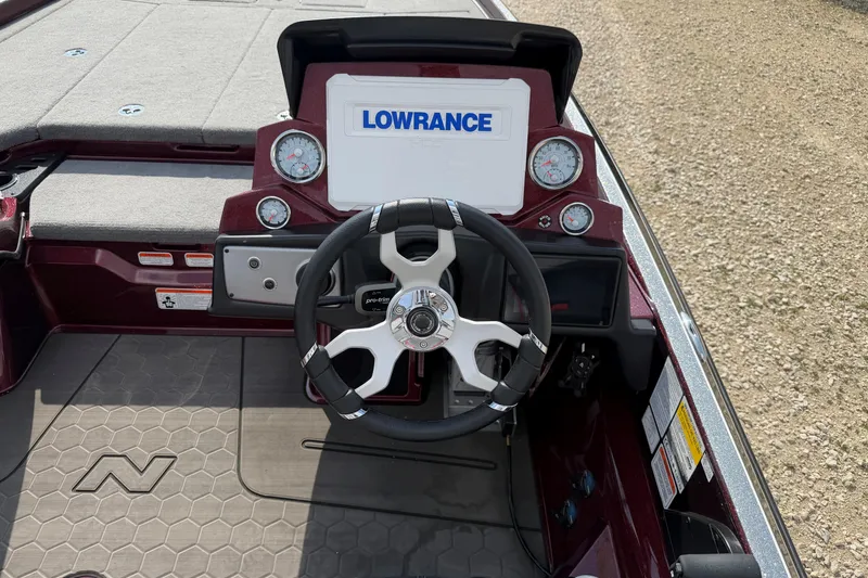 Slide: The Image of 2024 Nitro Z21 XL Pro boat dashboard with Lowrance display and steering wheel. - 6