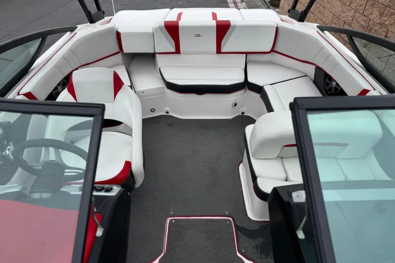 Slide: The Image of 2017 Regal 2000 ESX Bowrider interior with white and red seating, open layout. - 17