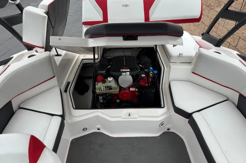 Slide: The Image of 2017 Regal 2000 ESX Bowrider engine compartment with seating, open hatch, and modern design. - 18