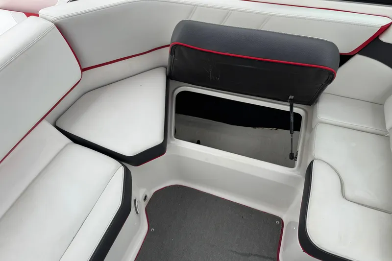 Slide: The Image of 2017 Regal 2000 ESX Bowrider interior seating with open storage compartment. - 20