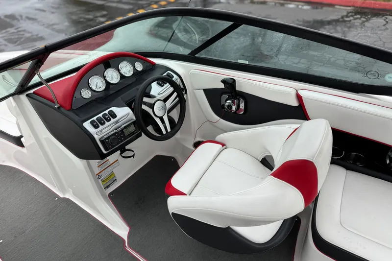 Slide: The Image of 2017 Regal 2000 ESX Bowrider interior with red and white seating, dashboard, and steering wheel. - 25