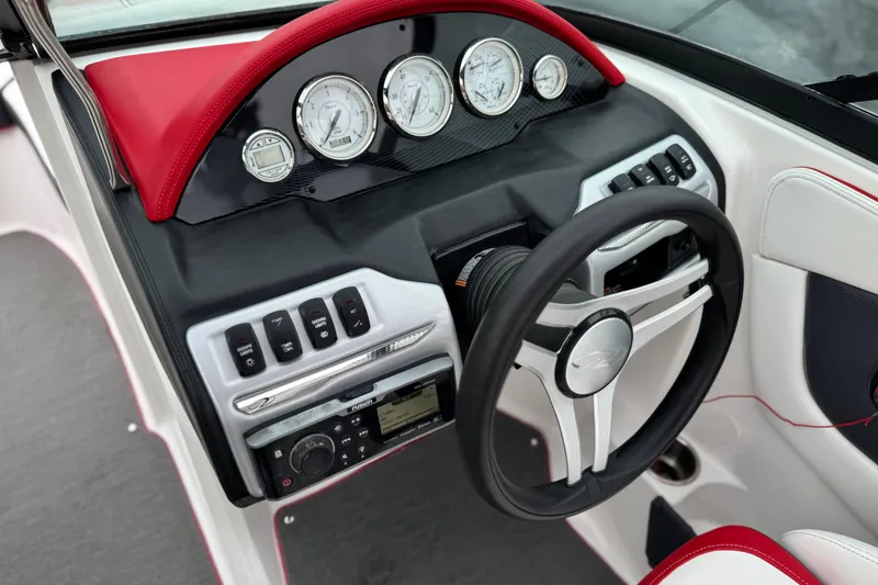 Slide: The Image of 2017 Regal 2000 ESX Bowrider dashboard with gauges and steering wheel. - 27