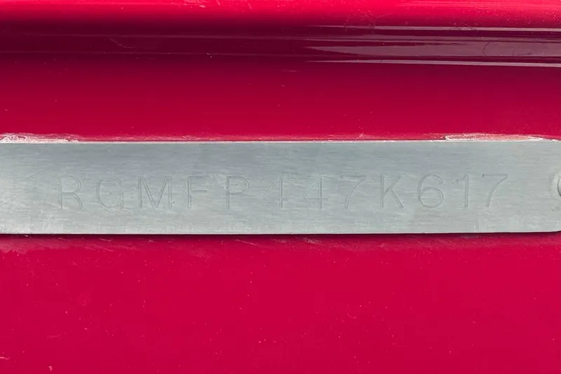 Slide: The Image of VIN plate on a 2017 Regal 2000 ESX Bowrider boat, red background. - 31