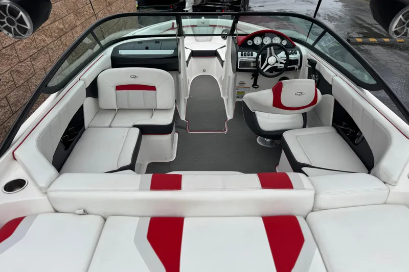 Slide: The Image of 2017 Regal 2000 ESX Bowrider interior with white and red seating, modern dashboard. - 8