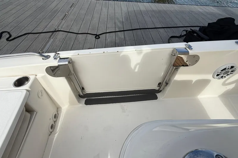 Slide: The Image of 2018 Boston Whaler 270 Dauntless boat interior with open transom door. - 14