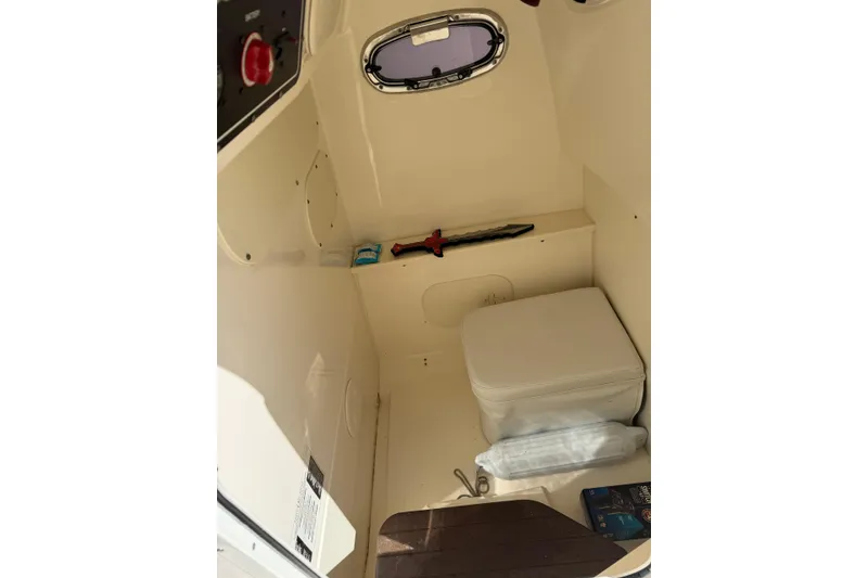 Slide: The Image of Interior of 2018 Boston Whaler 270 Dauntless boat with storage and equipment. - 30