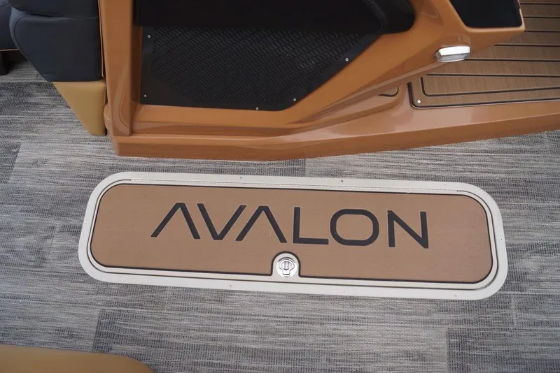 Slide: The Image of Avalon Catalina Versatile Rear Bench 2026 boat interior with logo on flooring. - 13